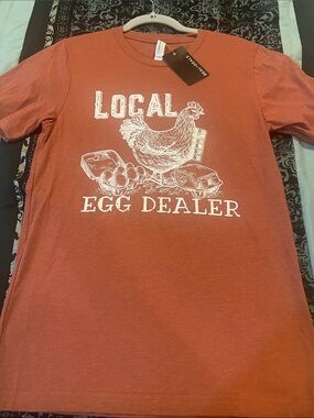 Rust Graphic Tee with White 'Local Egg Dealer' Print